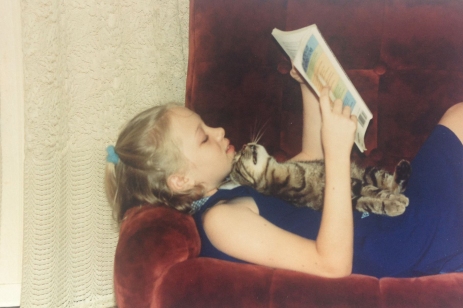 This is me at about 10 years of age reading a book I still use as a resource today - The Dictionary of Superstitions by Caradeau & Donner. Oh, and my cat, Tobias :)